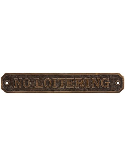 Cast Brass No Loitering Sign in Antique Brass.